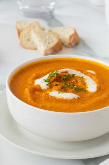 Carrot soup in a white bowl