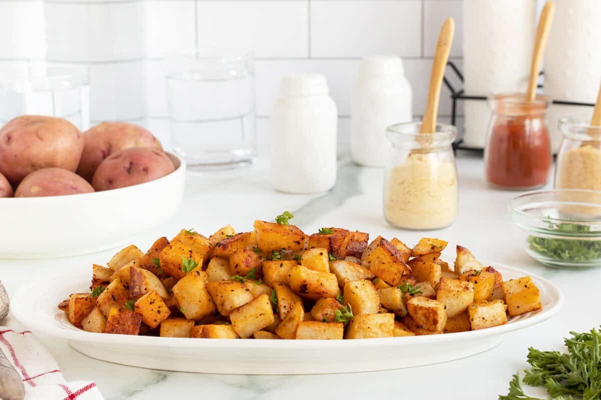 Breakfast potatoes on a white platter