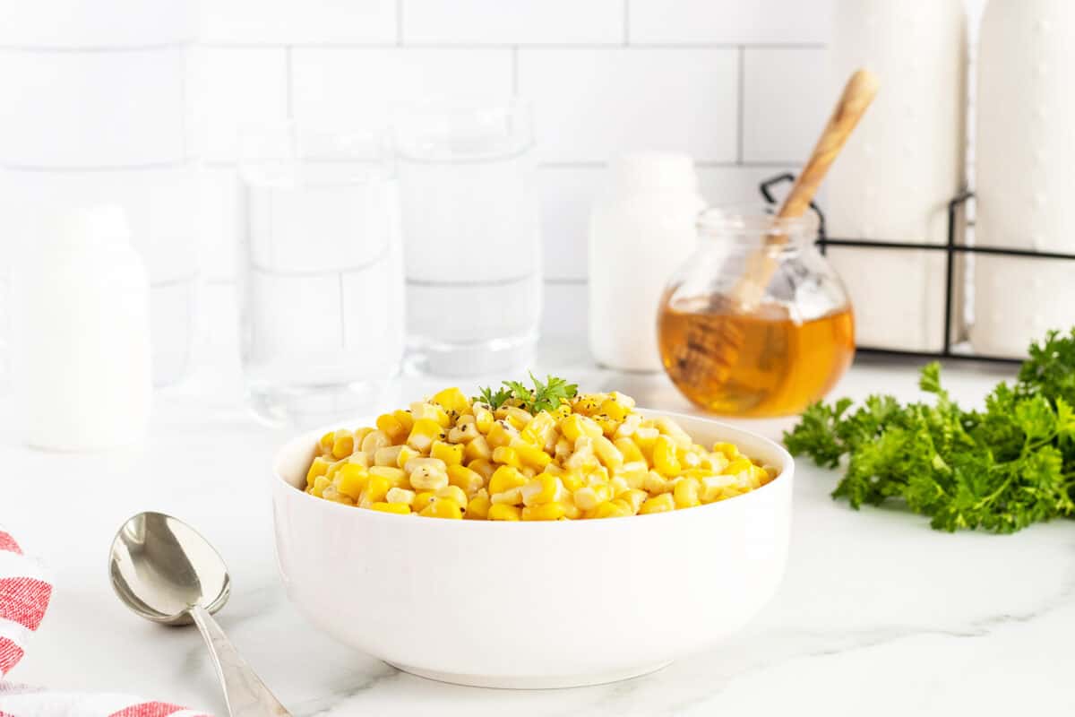 honey butter skillet corn in a white bowl