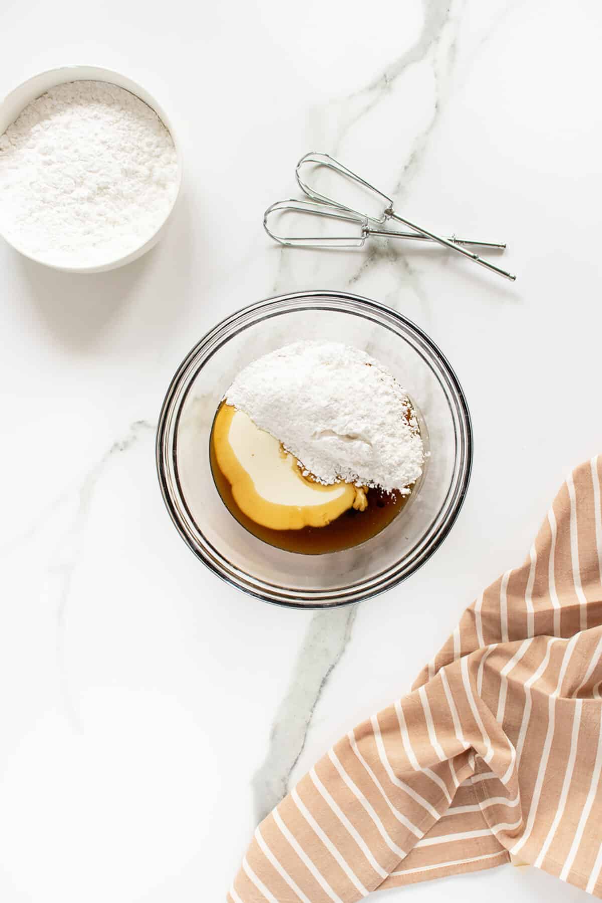 maple frosting ingredients in a mixingbowl unstirred