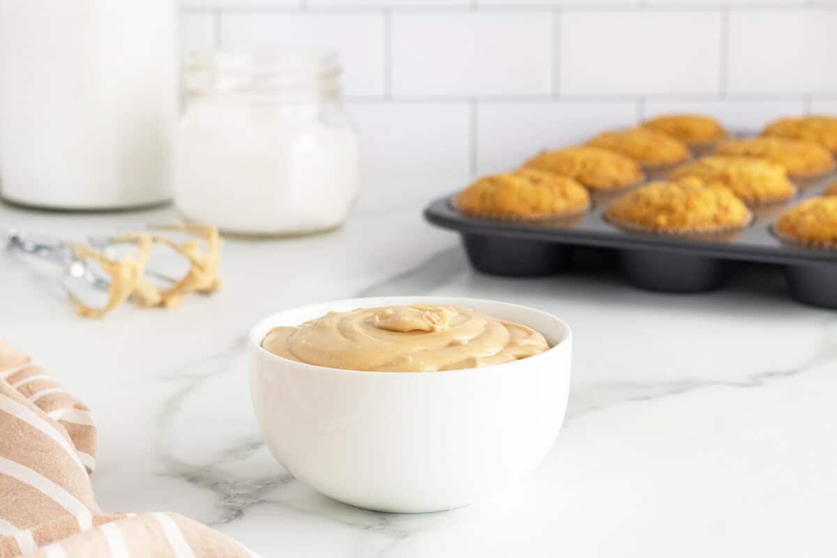 maple frosting in a white bowl