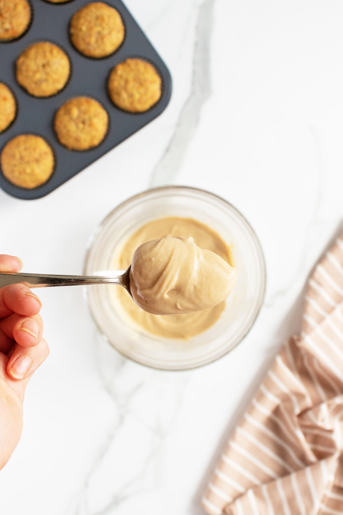 maple frosting on a metal spoon