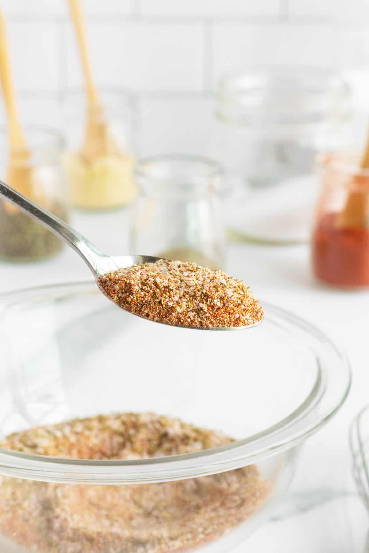 Chicken wing rub in a metal spoon