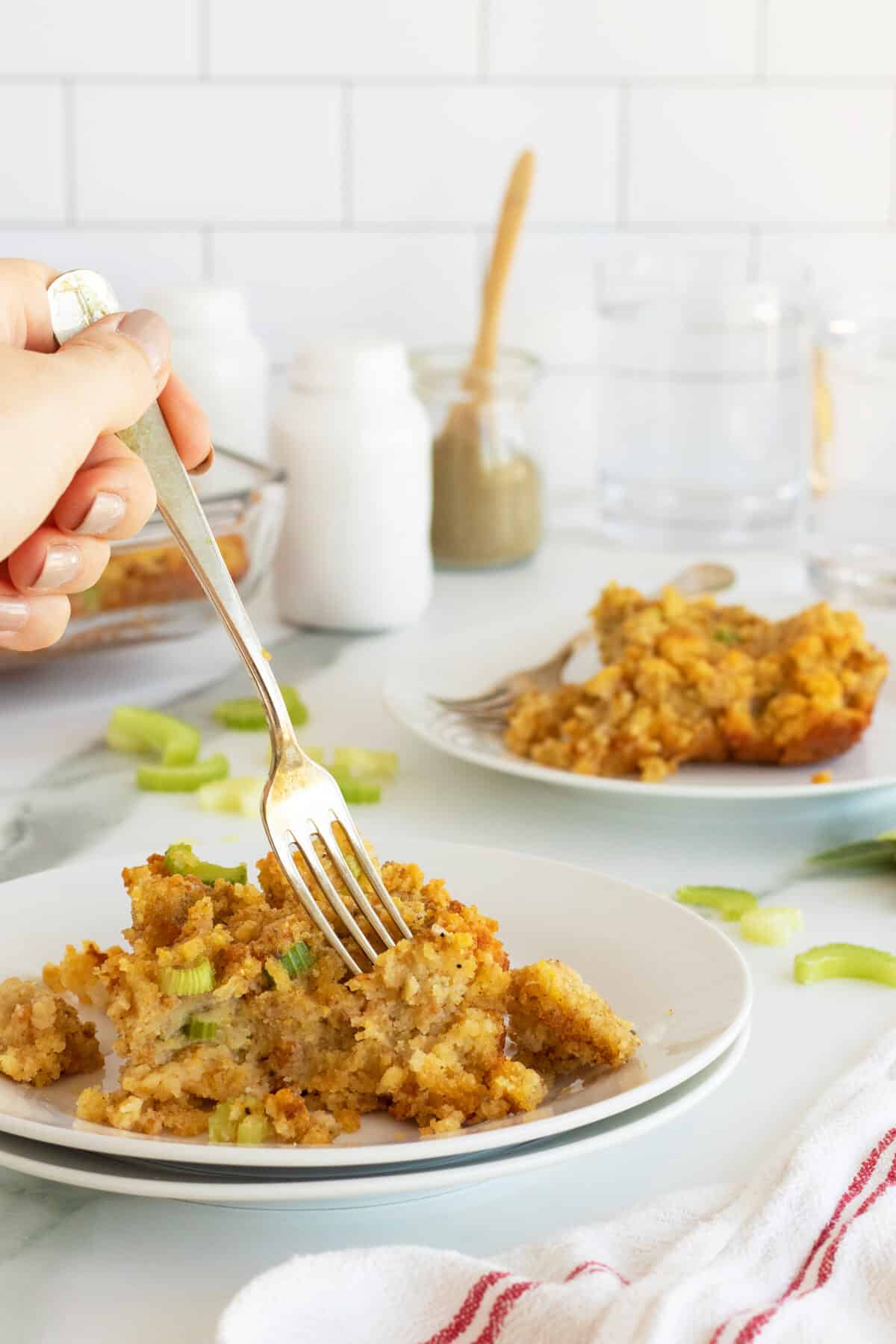 cornbread dressing on a plate with a fork