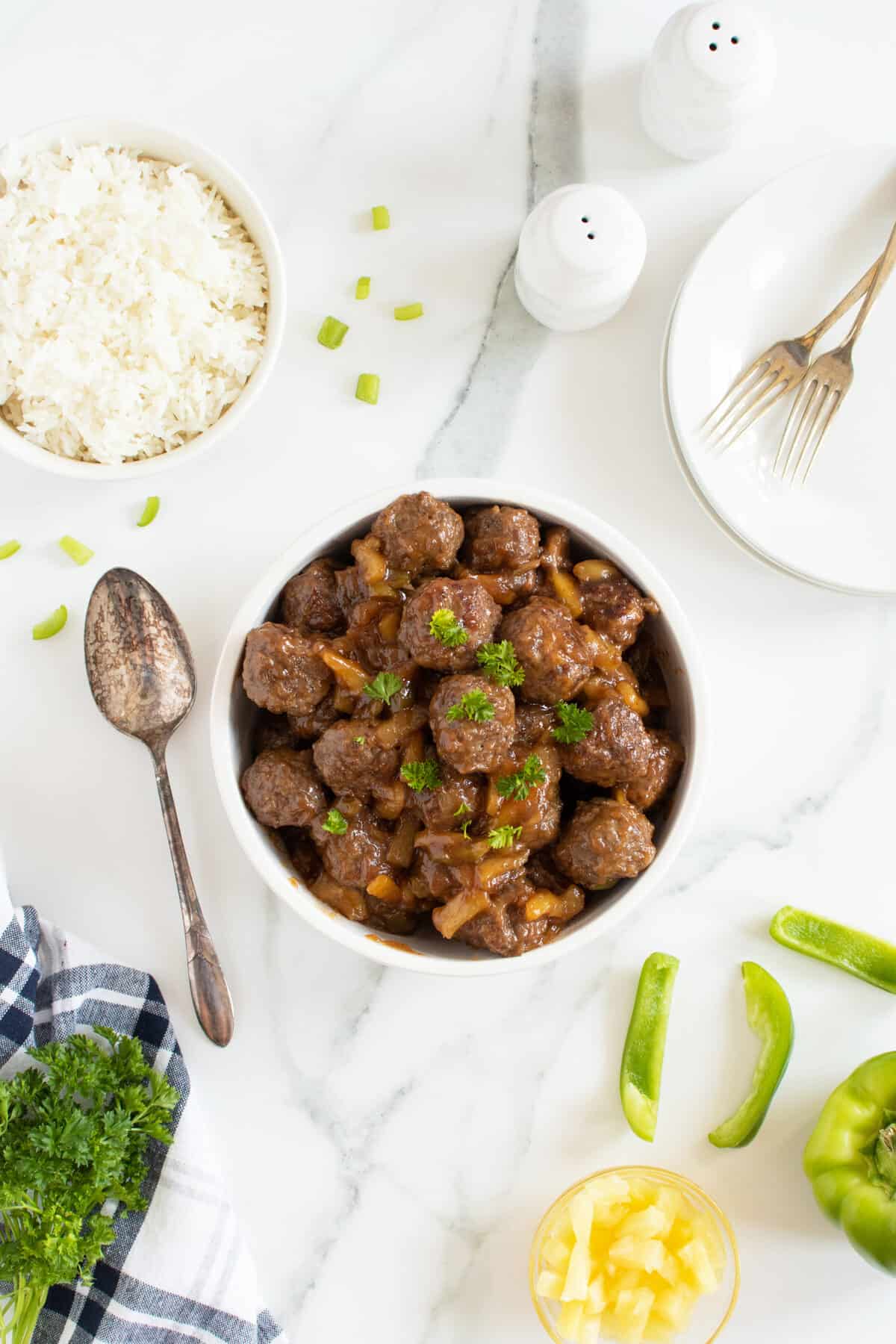 Hawaiian meatballs in a large white bowl