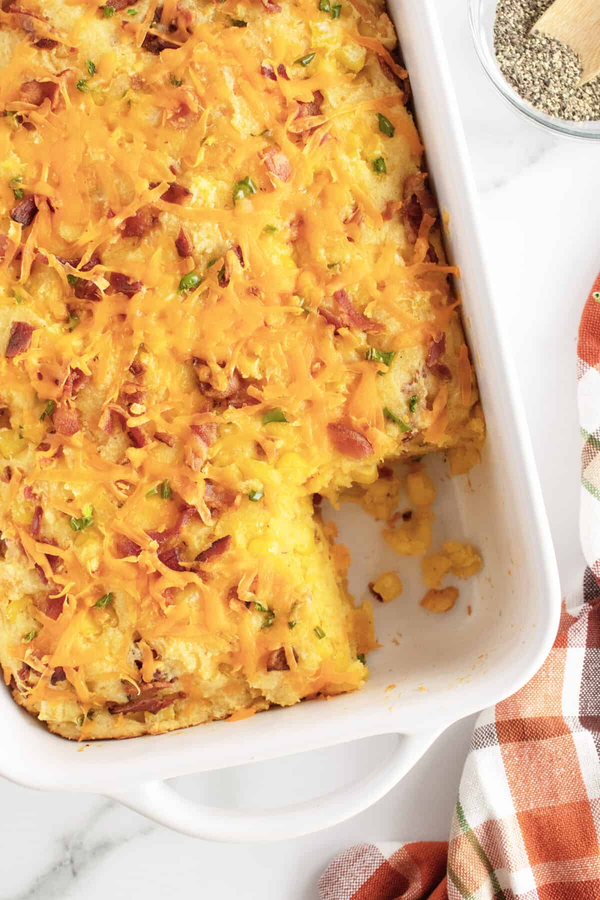 cornbread casserole with a corner cut out