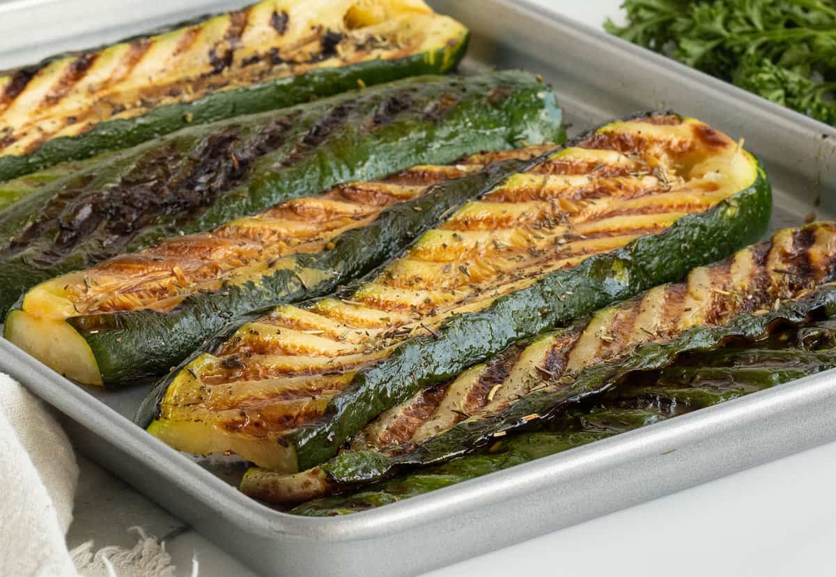 Sliced zucchini is grilled to perfection with charred edges and seasoning.