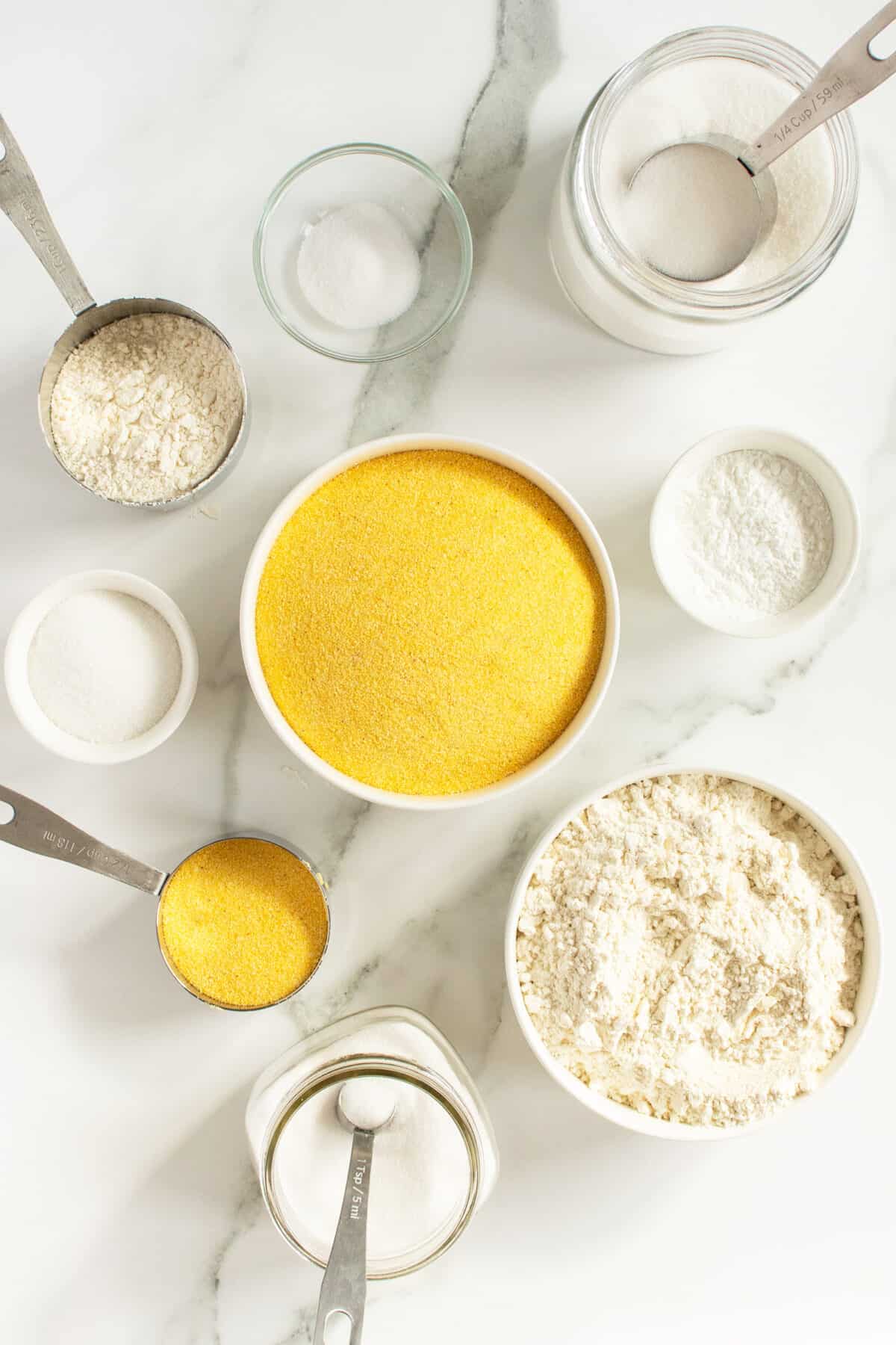 homemade cornbread mix ingredients in small bowls