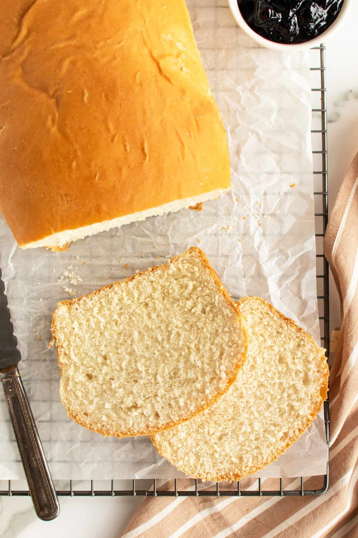 white bread loaf with two slices cut