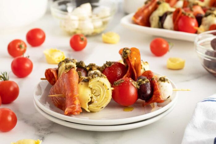 Antipasto skewers on a white plate