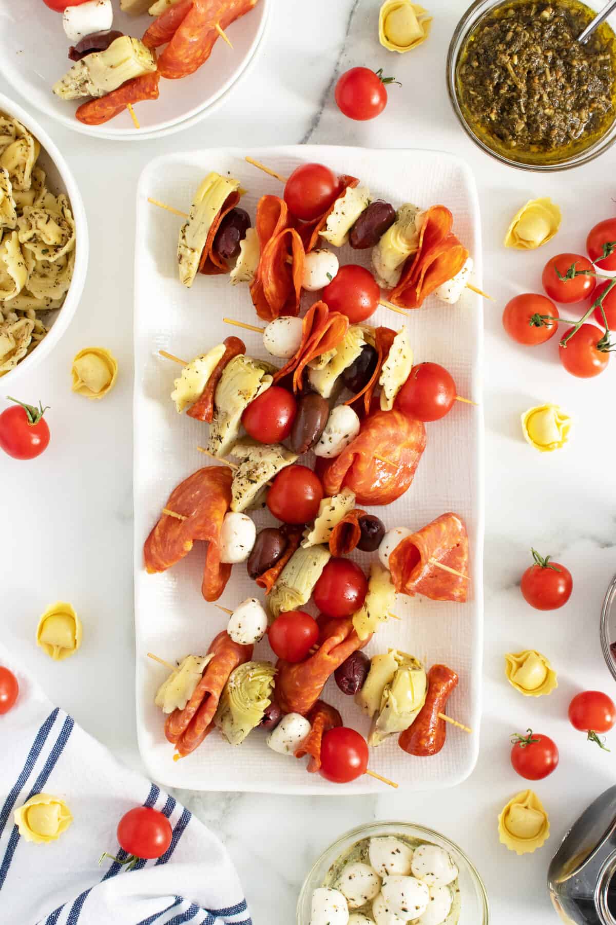 Antipasto skewers on a rectangle white platter