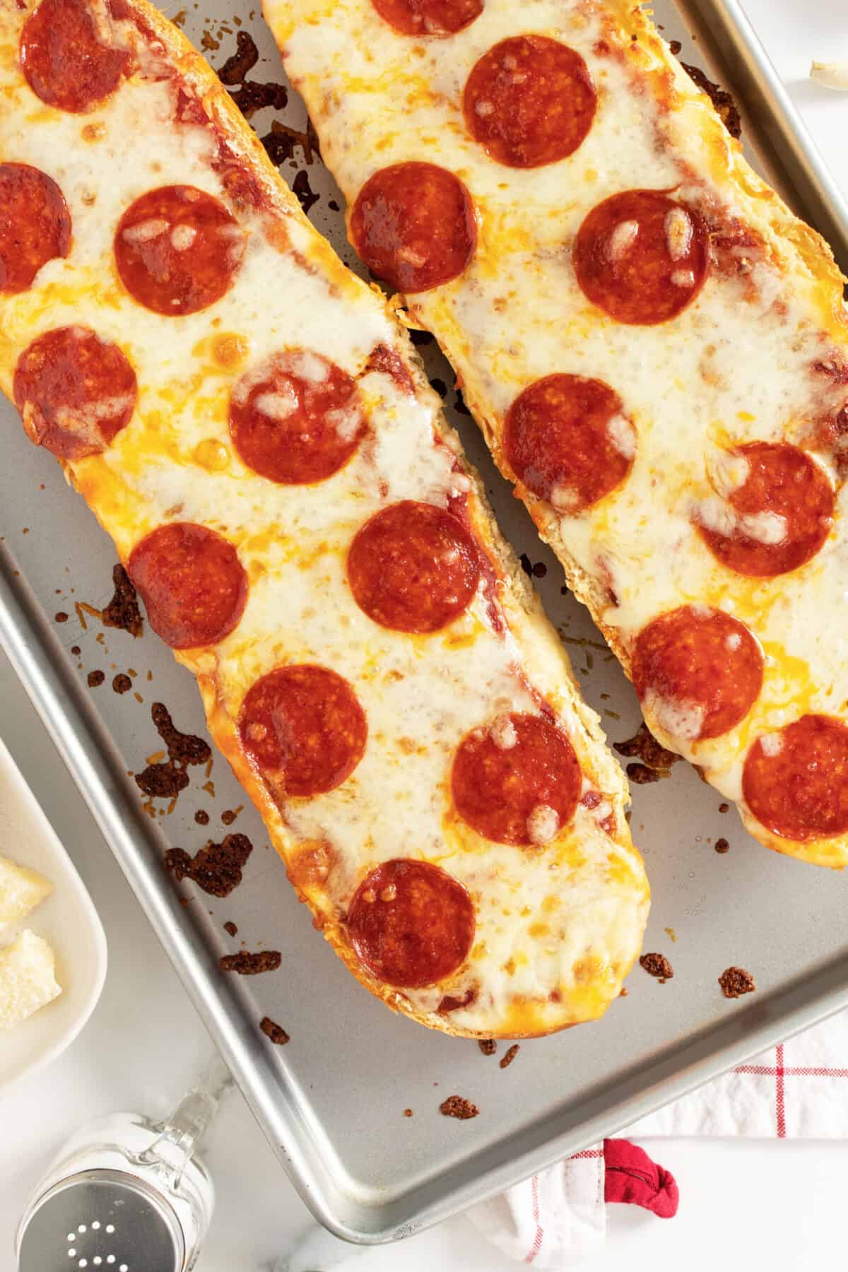 French Bread Pizza unsliced on a baking sheet