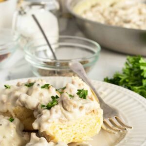 biscuits & gravy on a plate with a fork