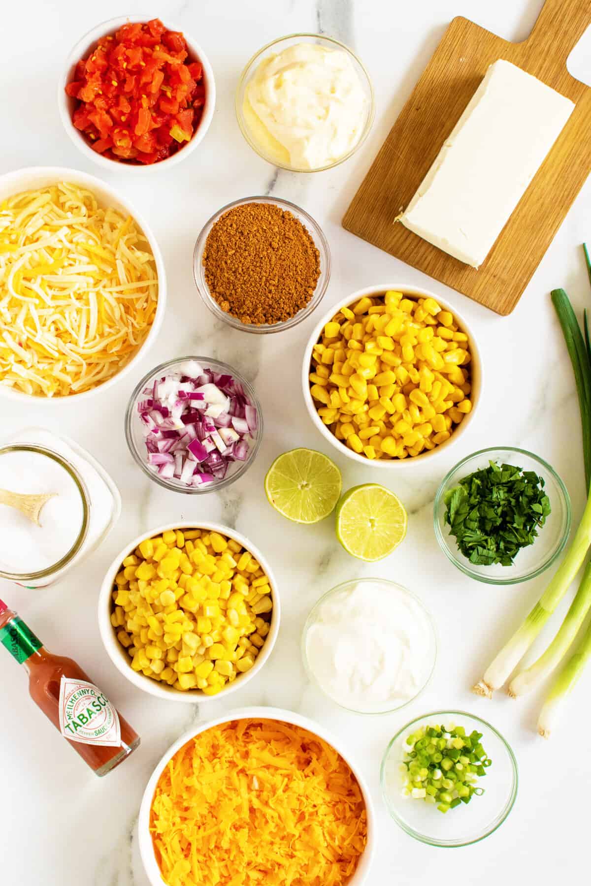 Corn Dip ingredients in small white bowls