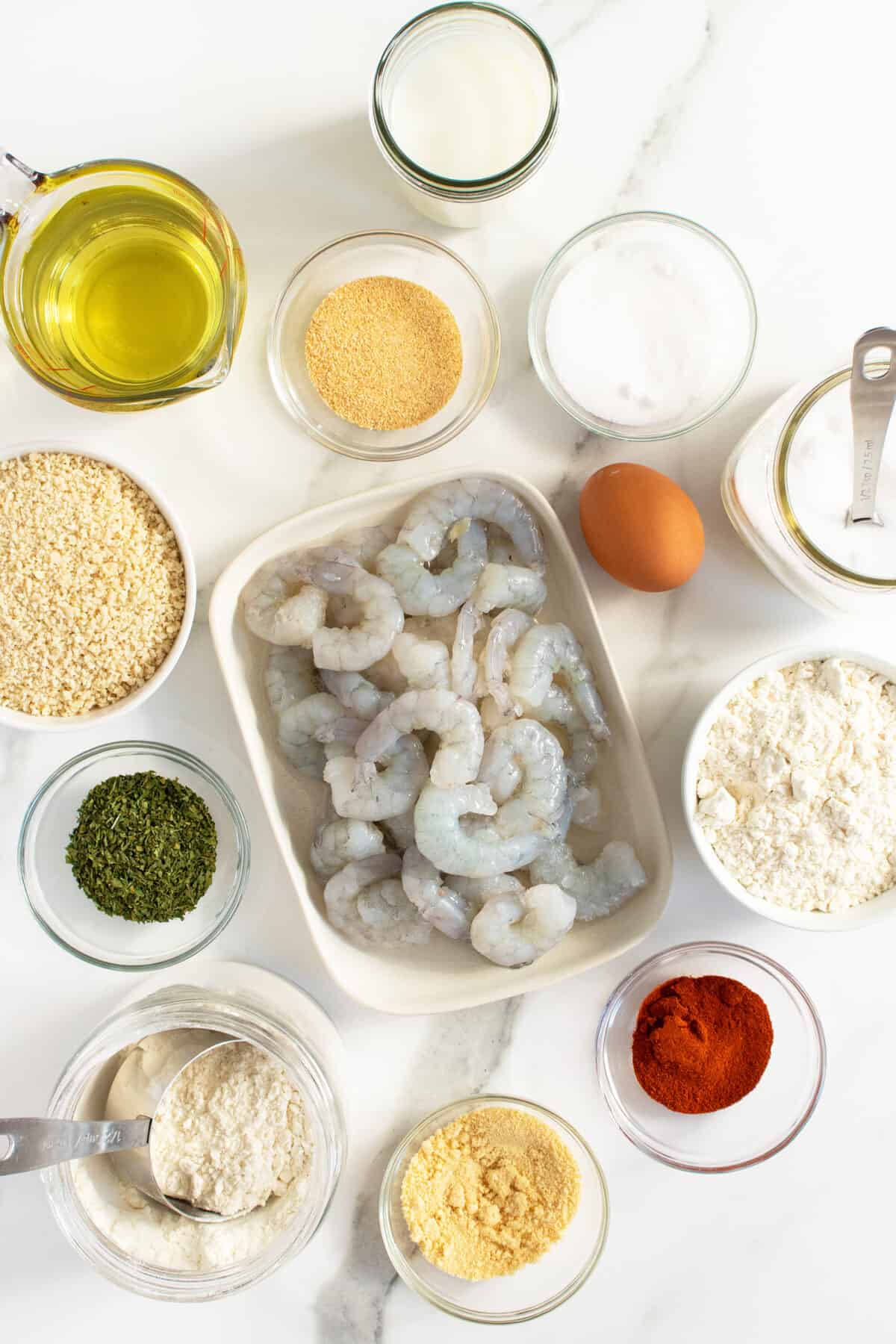  Popcorn Shrimp ingredients in small bowls surrounding raw shrimp