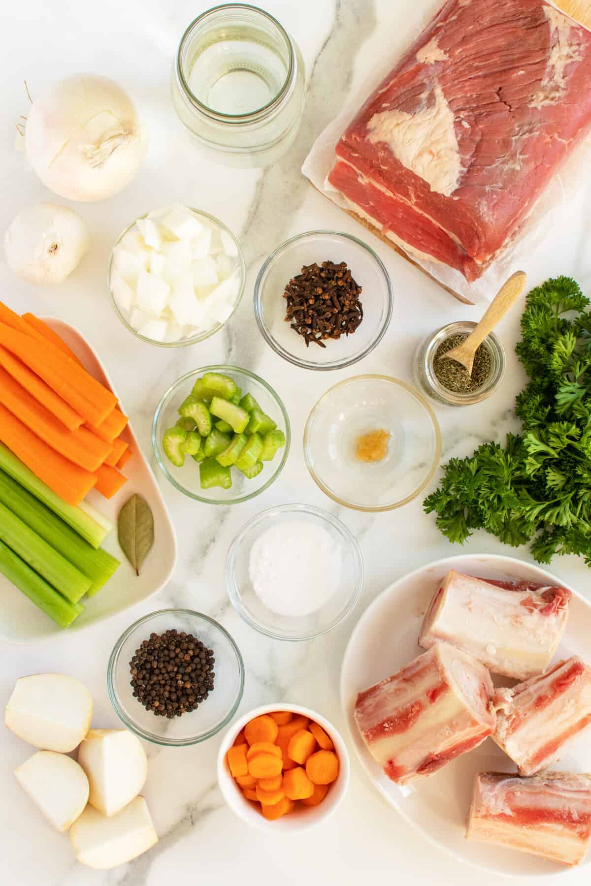 pot au feu ingredients ona white table