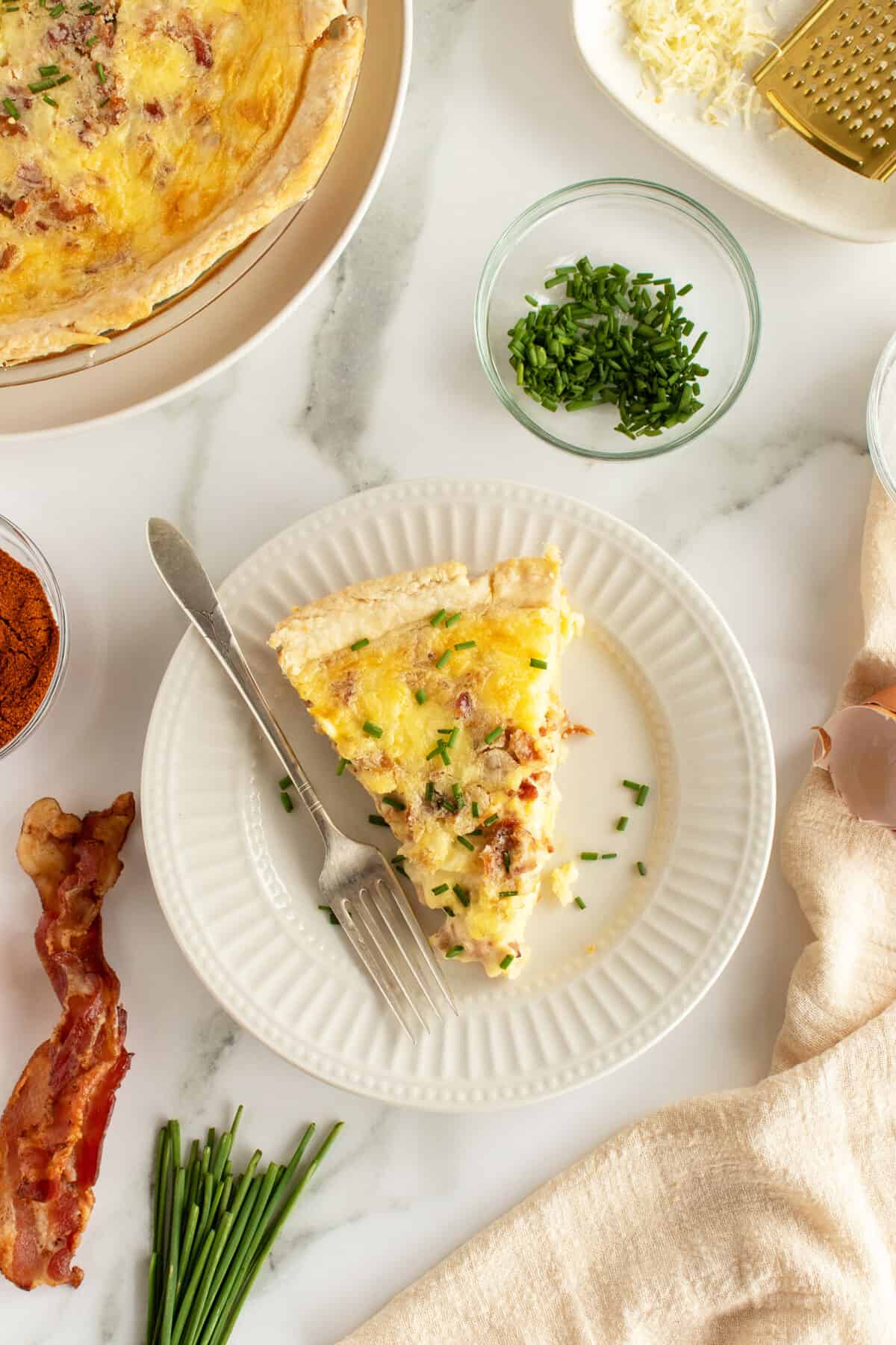 quiche lorraine slice on a white plate