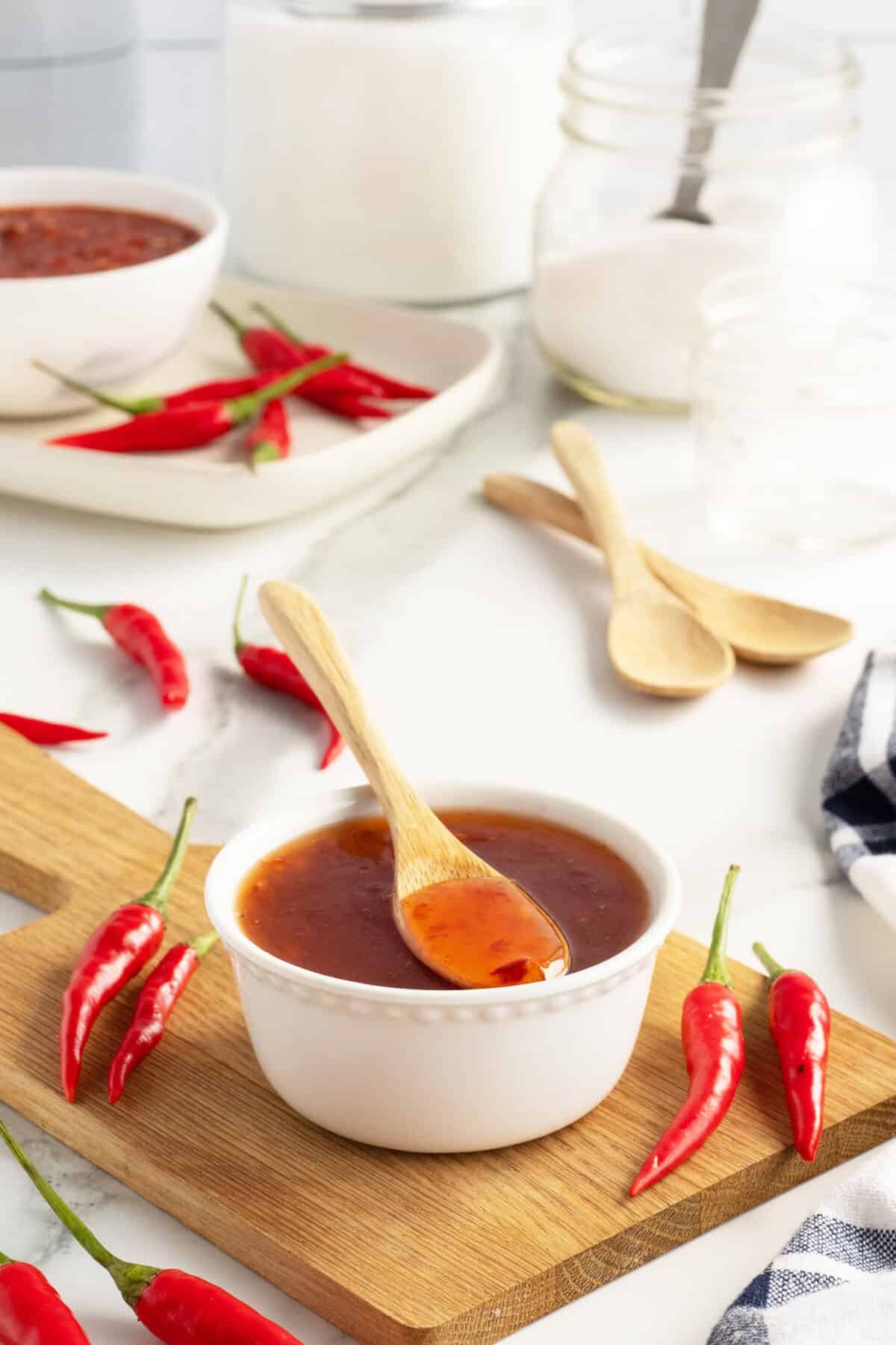 sweet chili sauce in a white ramekin with spoon