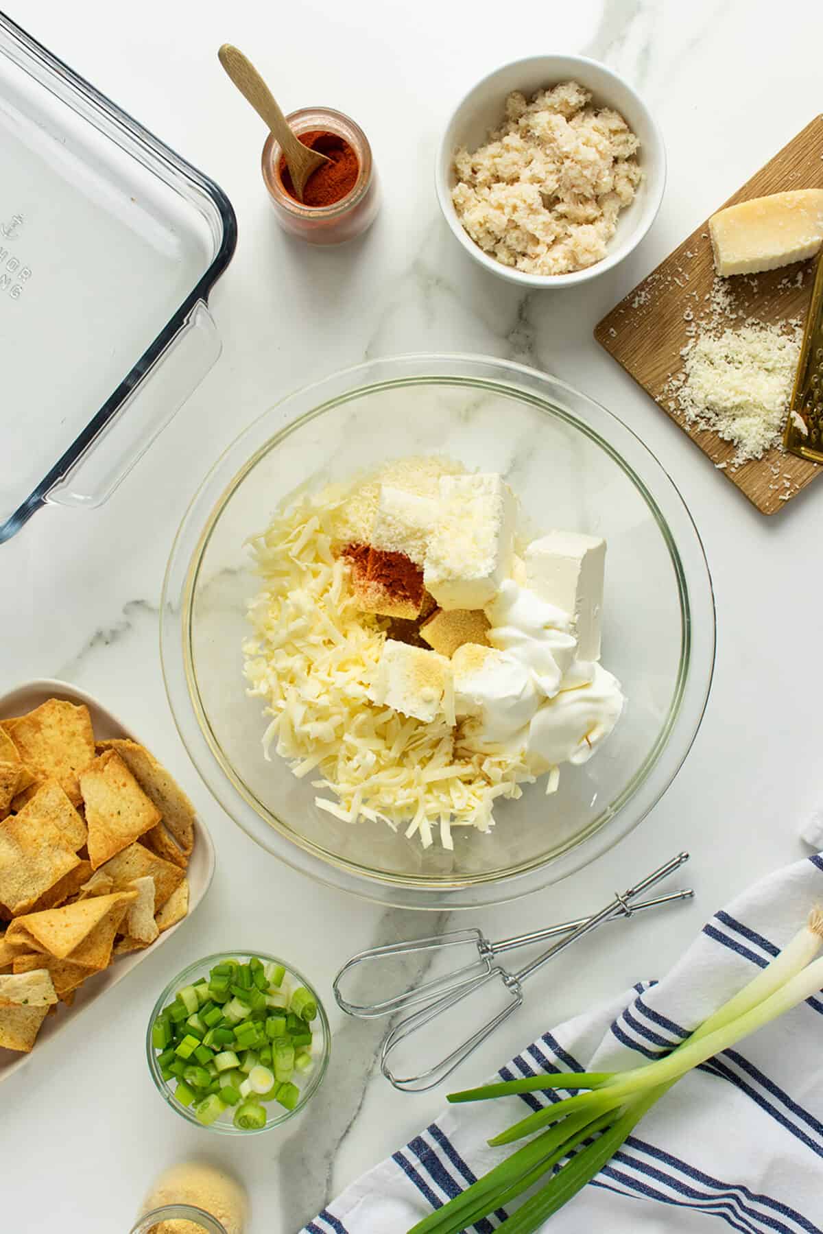 crab rangoon ingredients in a clear mixing bowl unstirred