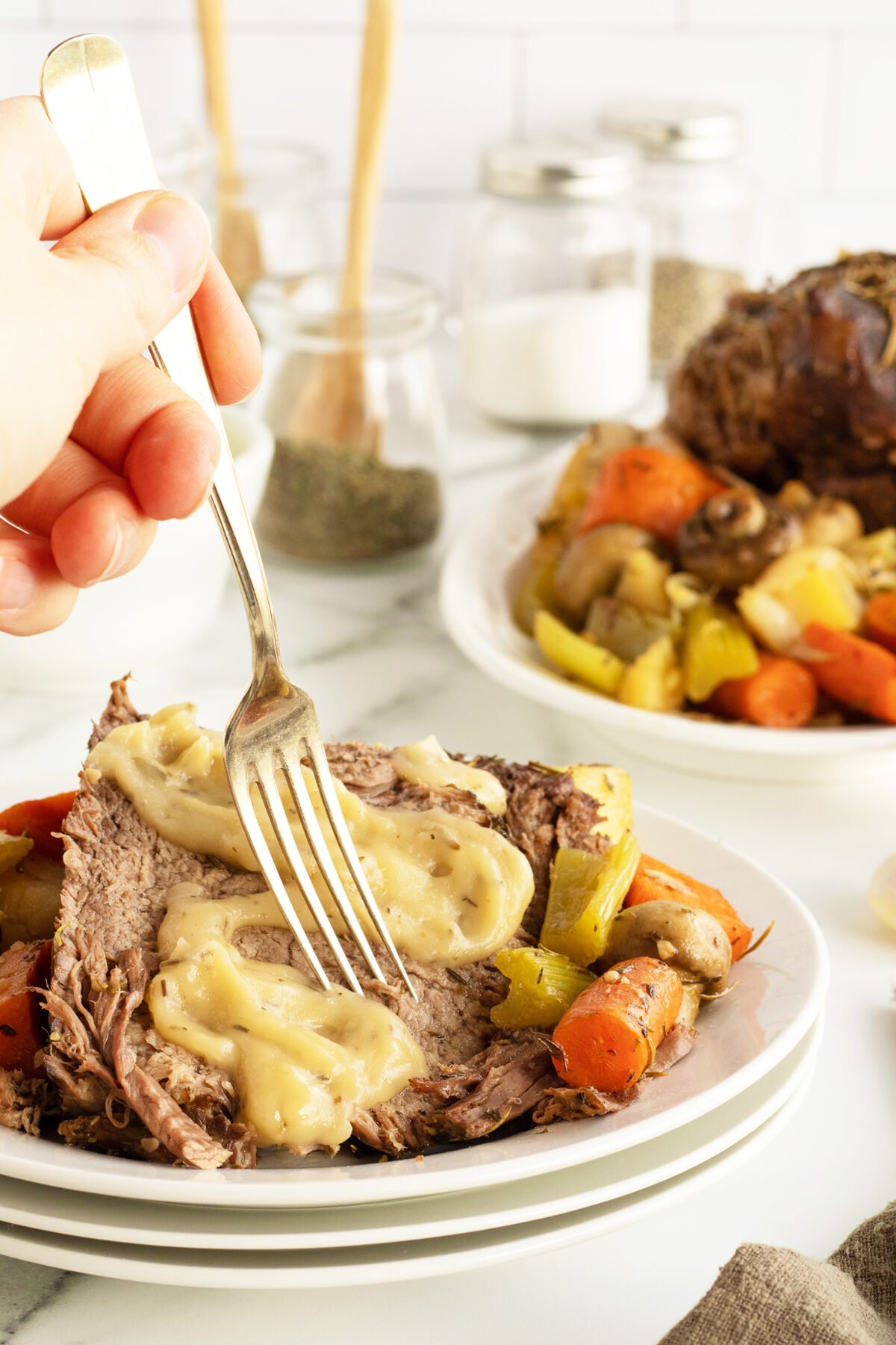 cross rib roast slice with gravy and a fork
