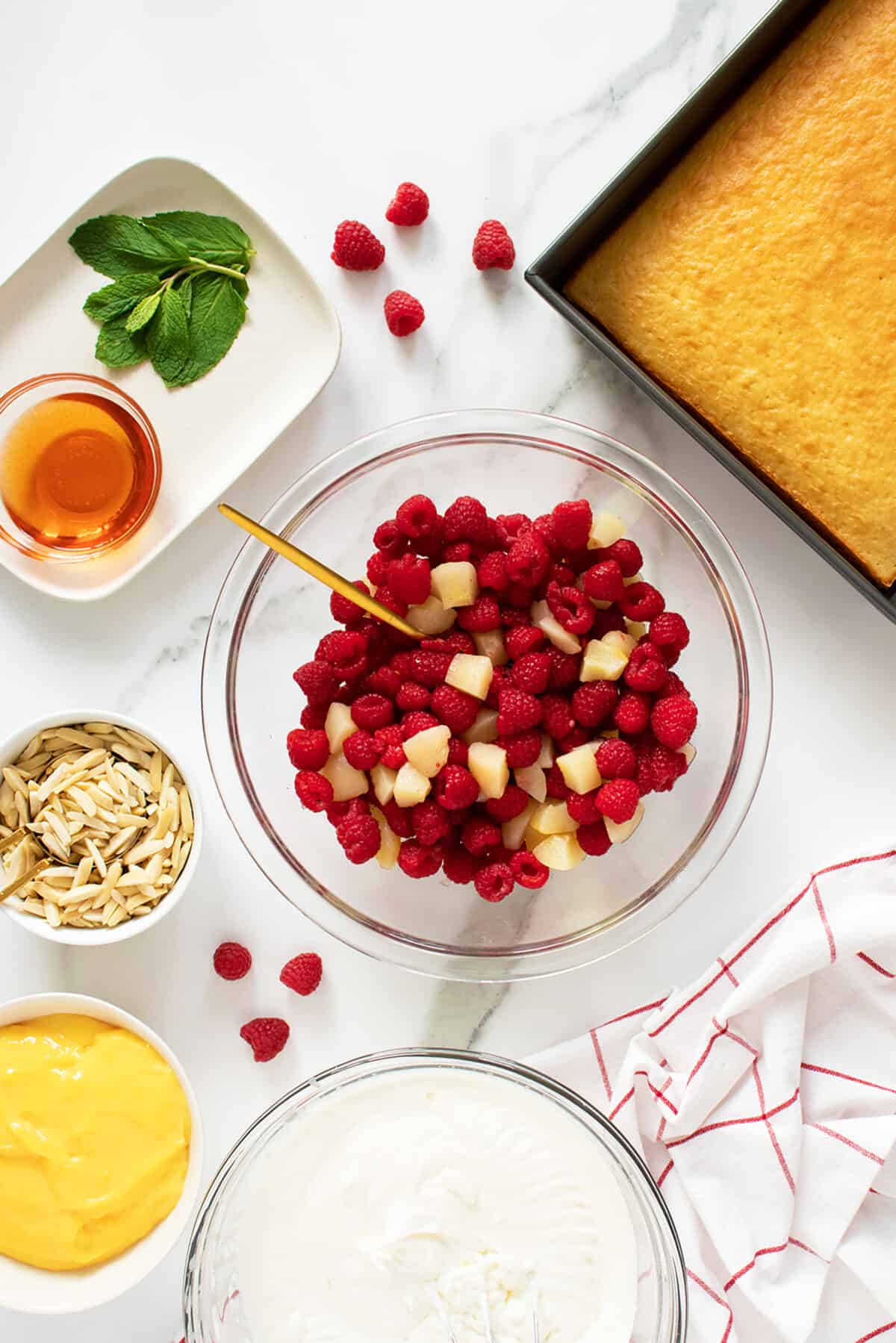 English Christmas Trifle barries nad pears in mixing bowl