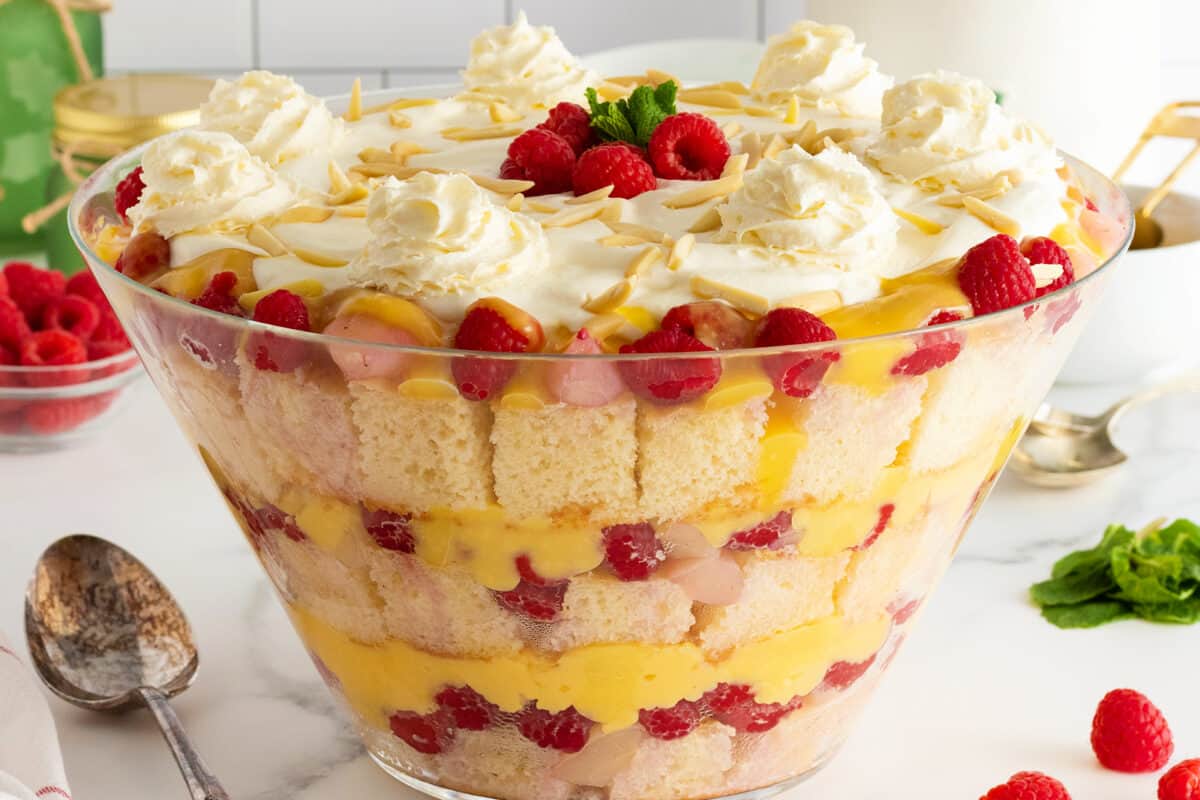English Christmas Trifle in a glass trifle bowl with layers of berries and cake