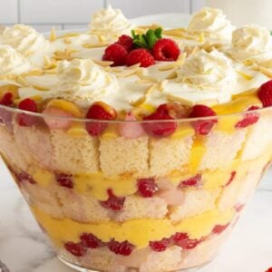 English Christmas Trifle in a glass trifle bowl with layers of berries and cake