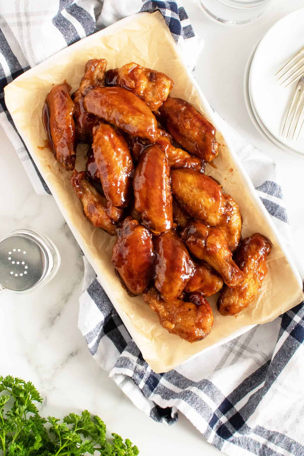 Honey BBQ wings on a rectangular white platter