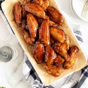 Honey BBQ wings on a rectangular white platter