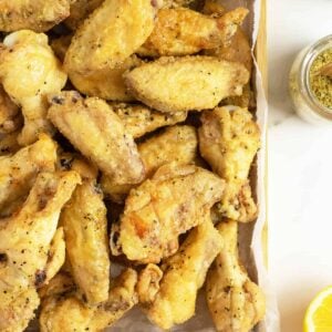 lemon pepper wings on a baking tray closeup