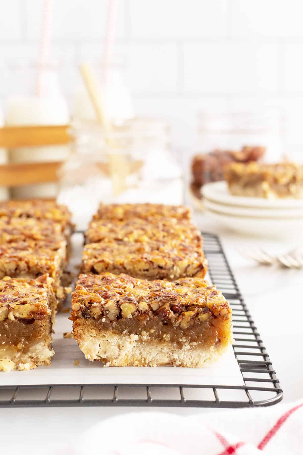 pecan pie bars on a sheet of parchment paper