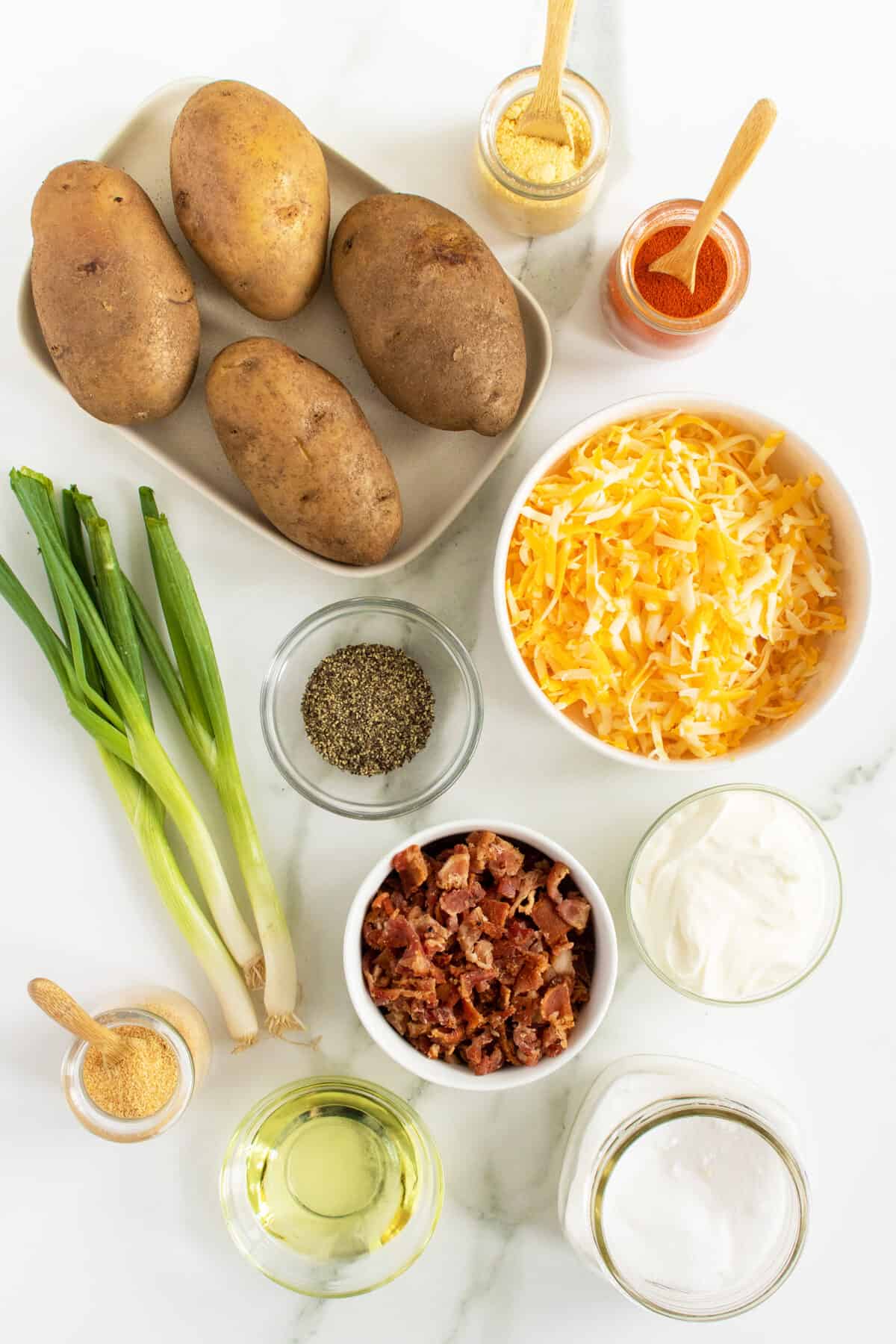 potato skins ingredients in white bowls