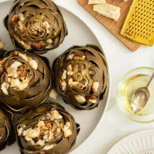 Stuffed Artichokes on a white plate