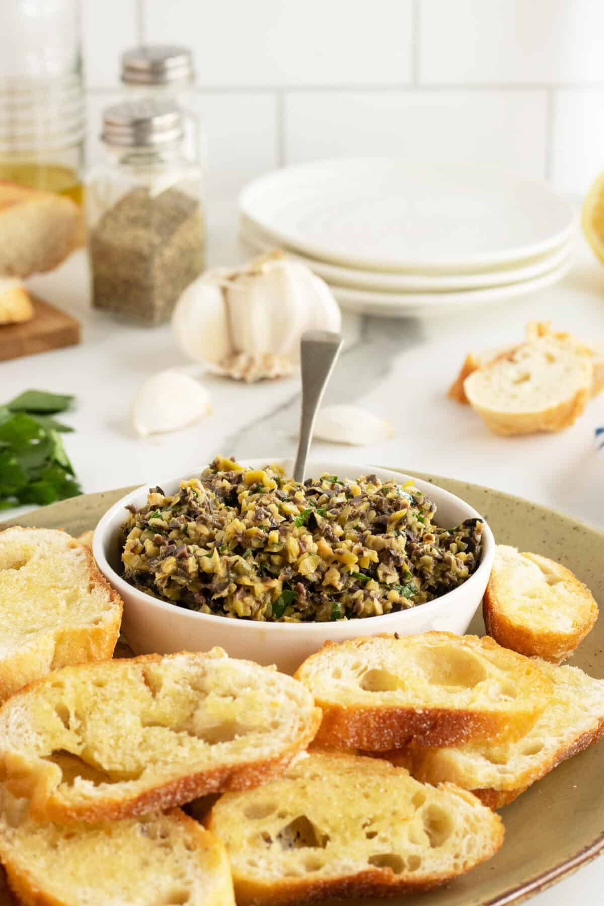 tapenade in a bowl with a spoon
