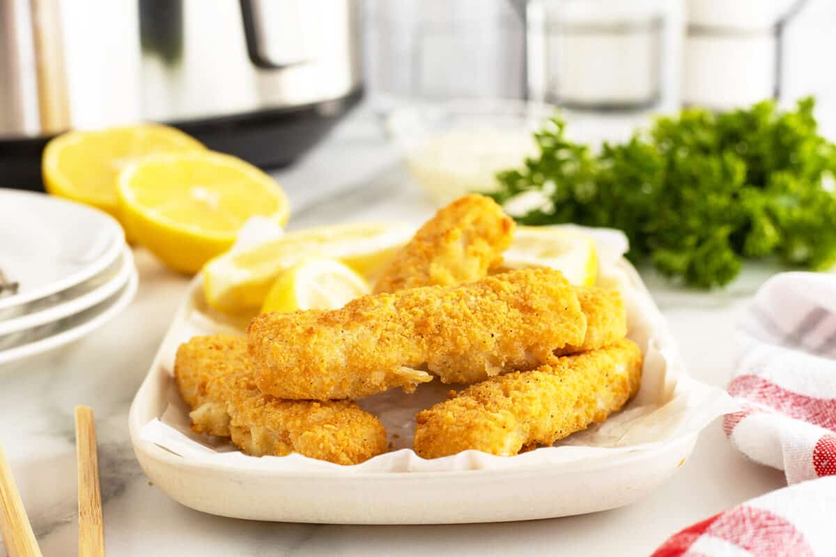 air fryer fish sticks on a white plate