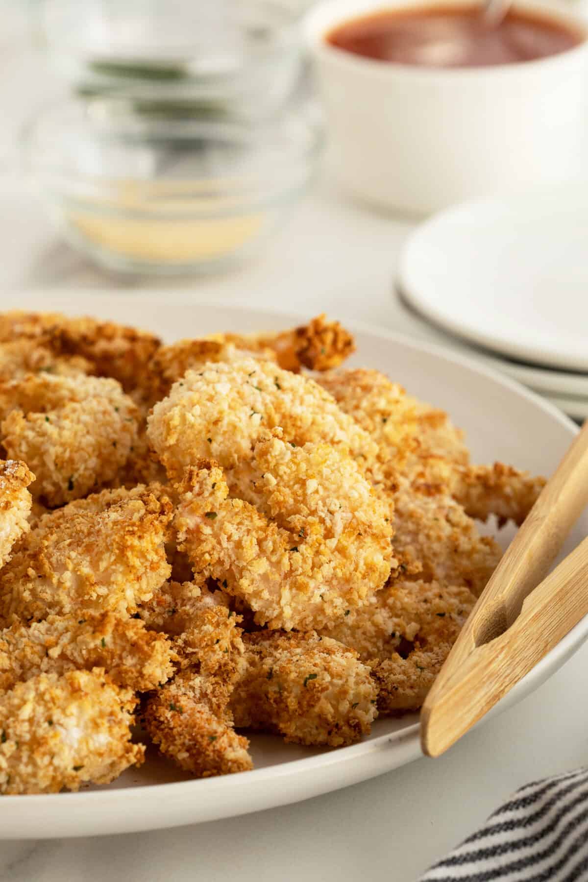 air fryer popcorn shrimp on a plate with chopsticks