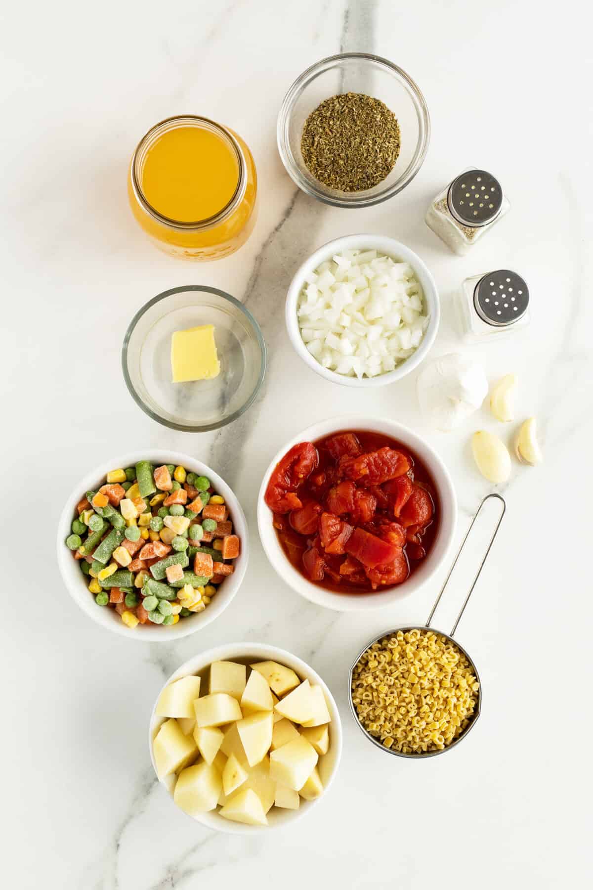 alphabet soup ingredients in small clear and white bowls