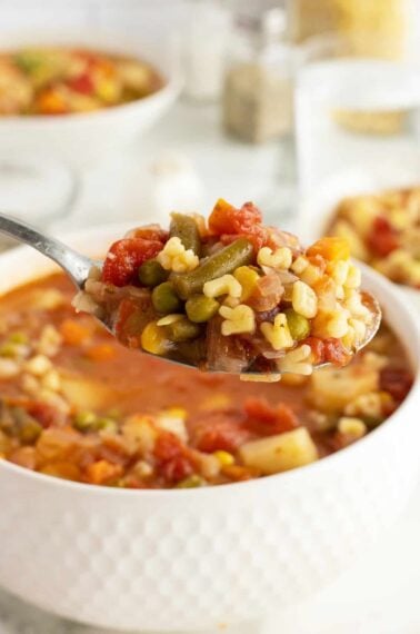 alphabet soup piled on a spoon