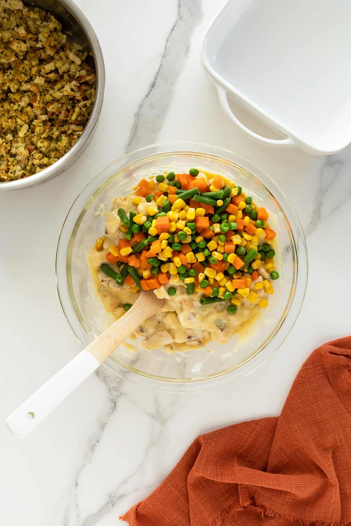 Chicken and stuffing casserole soup and vegetables in a glass bowl