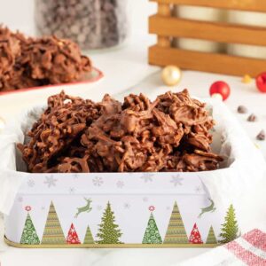haystack cookies in a festive cookie tin with christmas trees