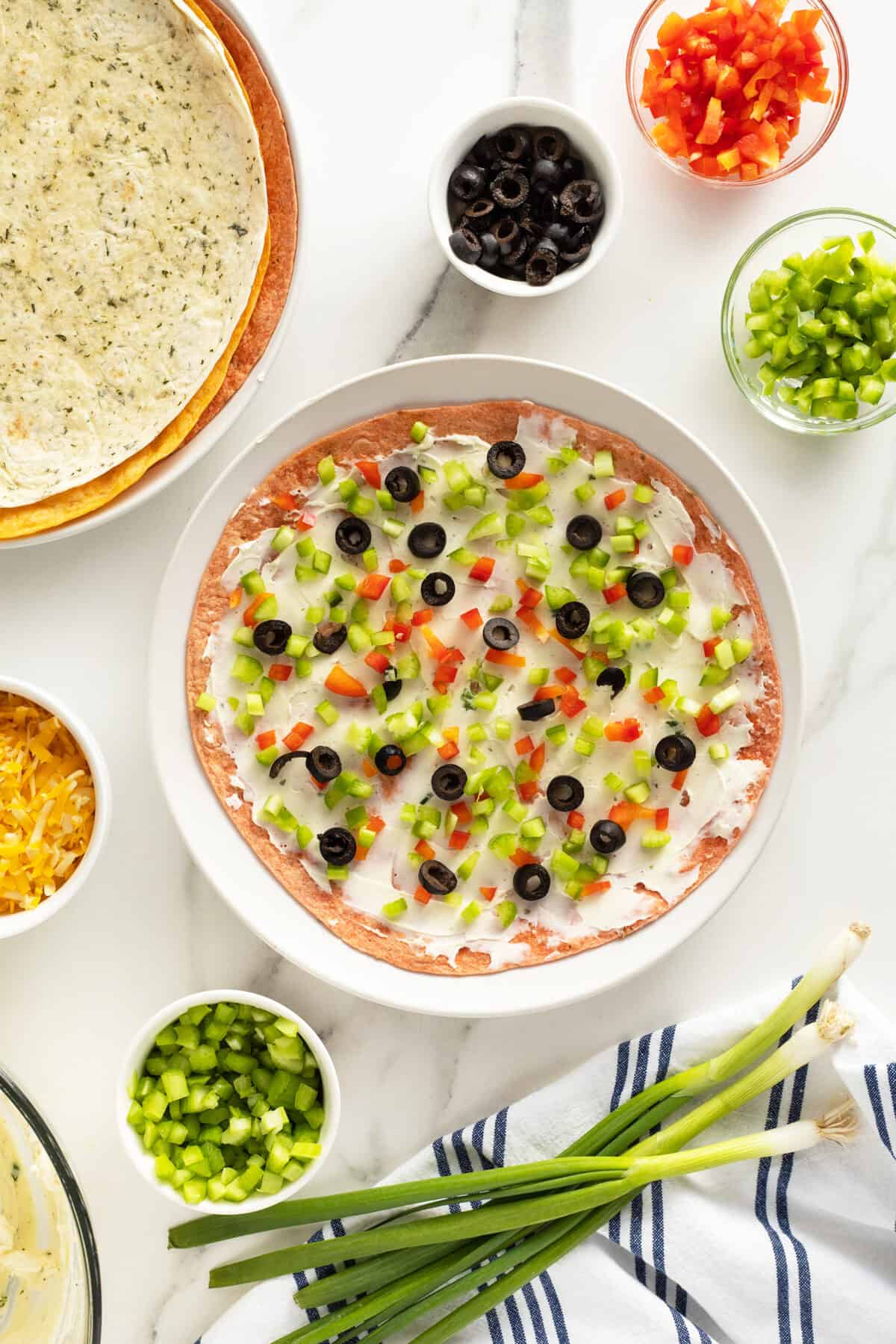 Party Pinwheels being made on an open tortilla