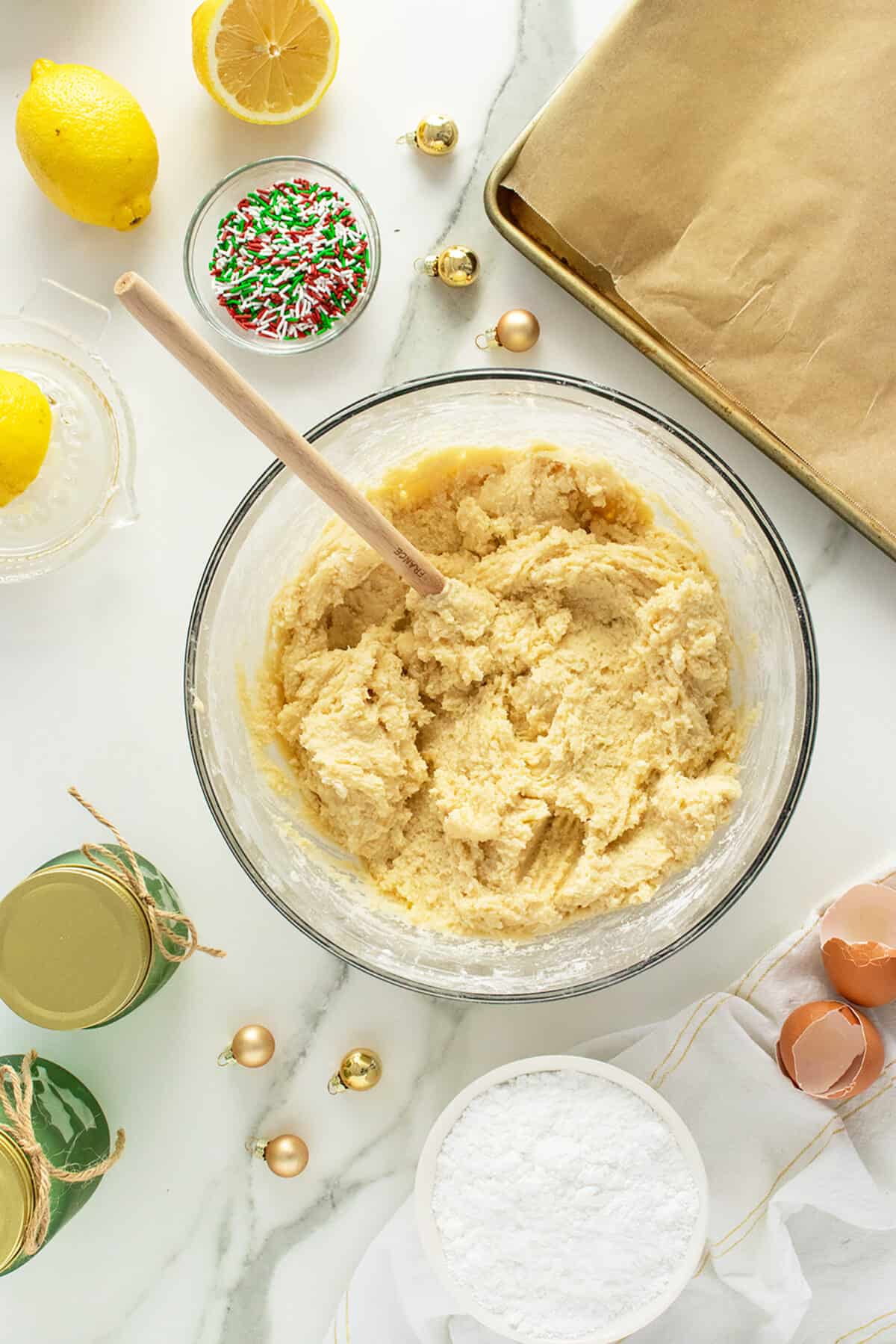 ricotta cookies dough in a bowl with wooden spoon