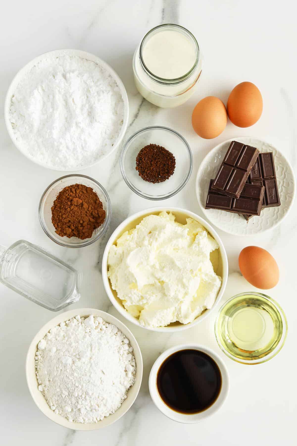 tiramisu cake ingredients in small white and clear bowls