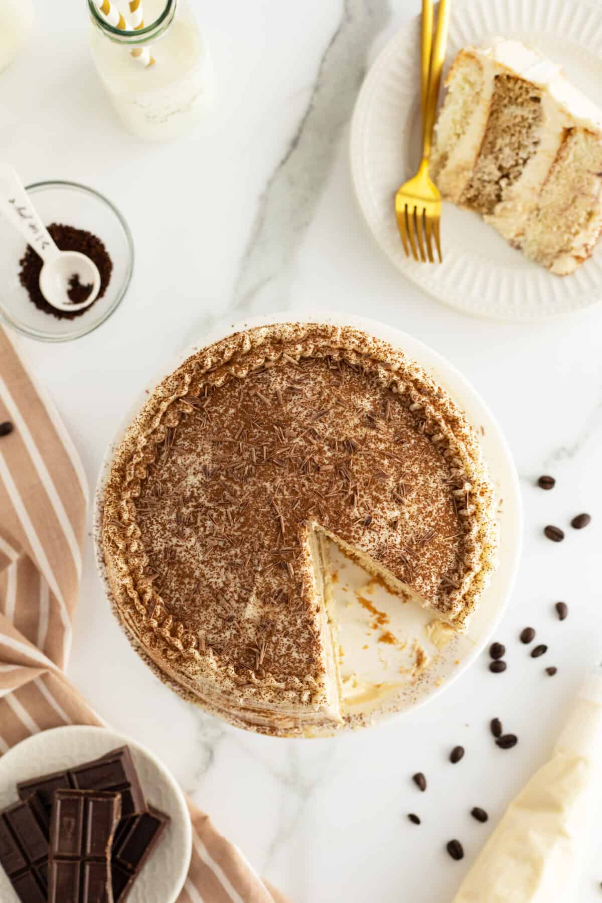 tiramisu cake overhead view with slice cut out