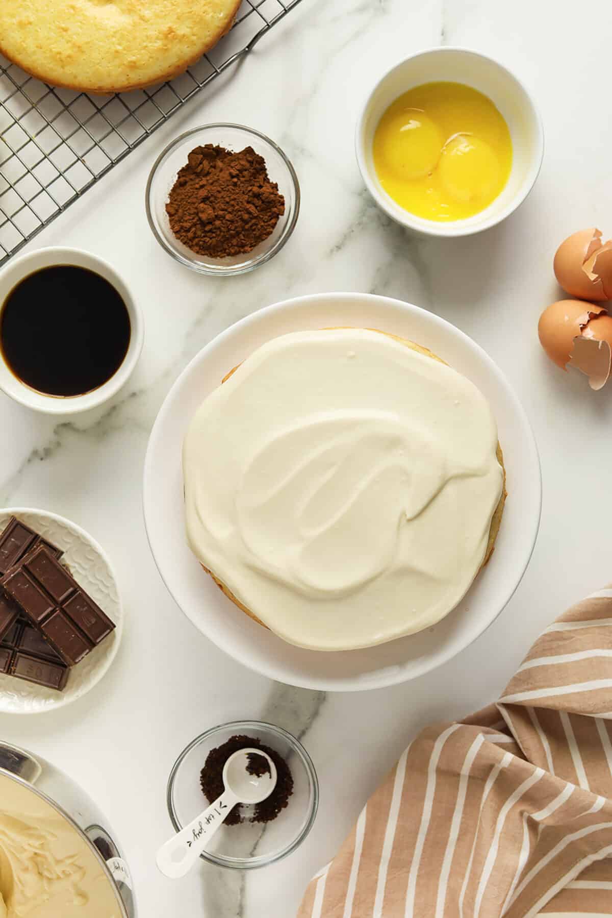 tiramisu cake with cream spread on top of cake