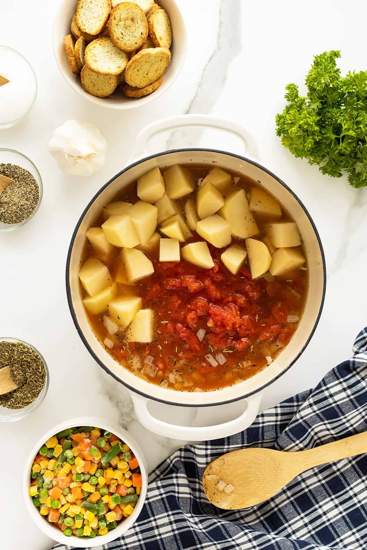 vegetable soup potatoes being added to pot