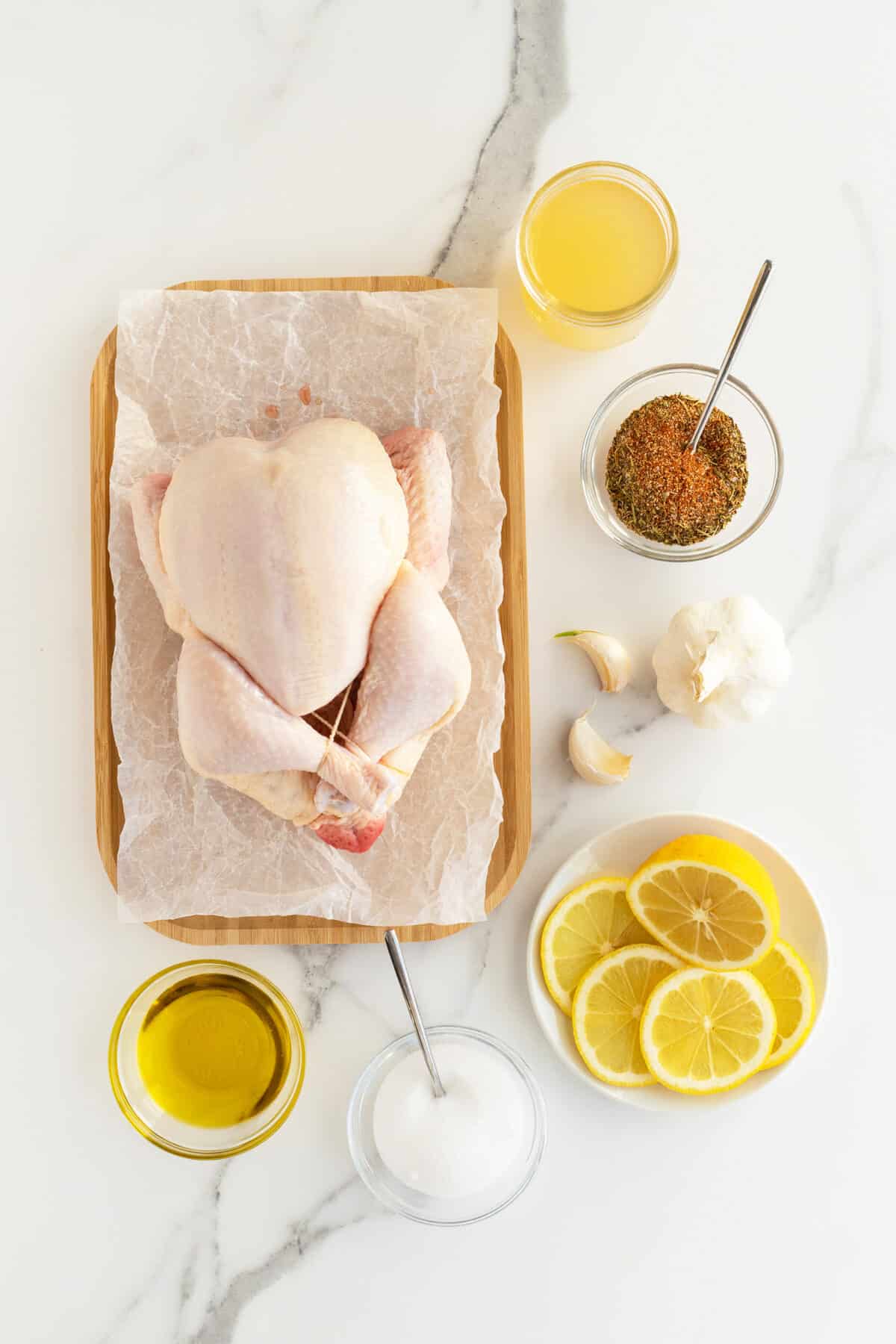 Instant Pot Whole Chicken ingredients around a whole raw chicken