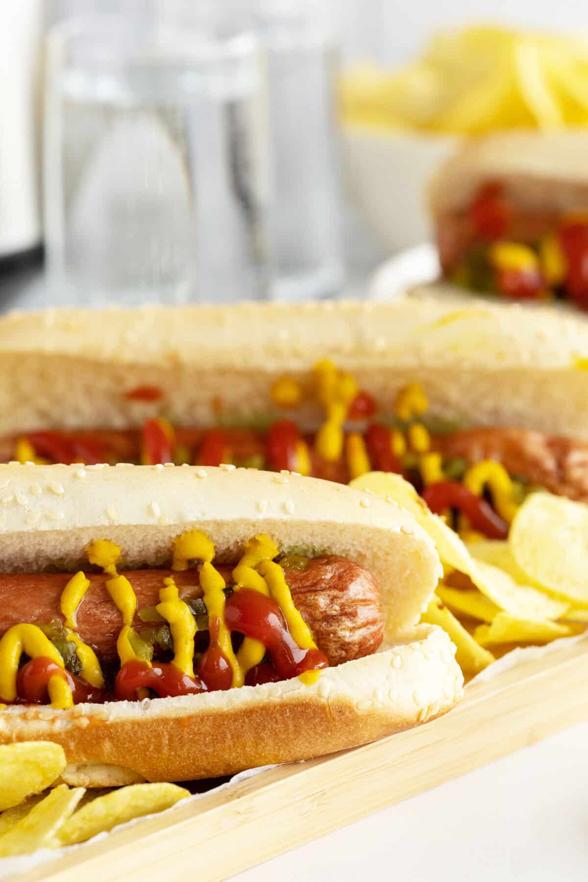 airfryer hot dogs with ketchup and mustard ona cutting board