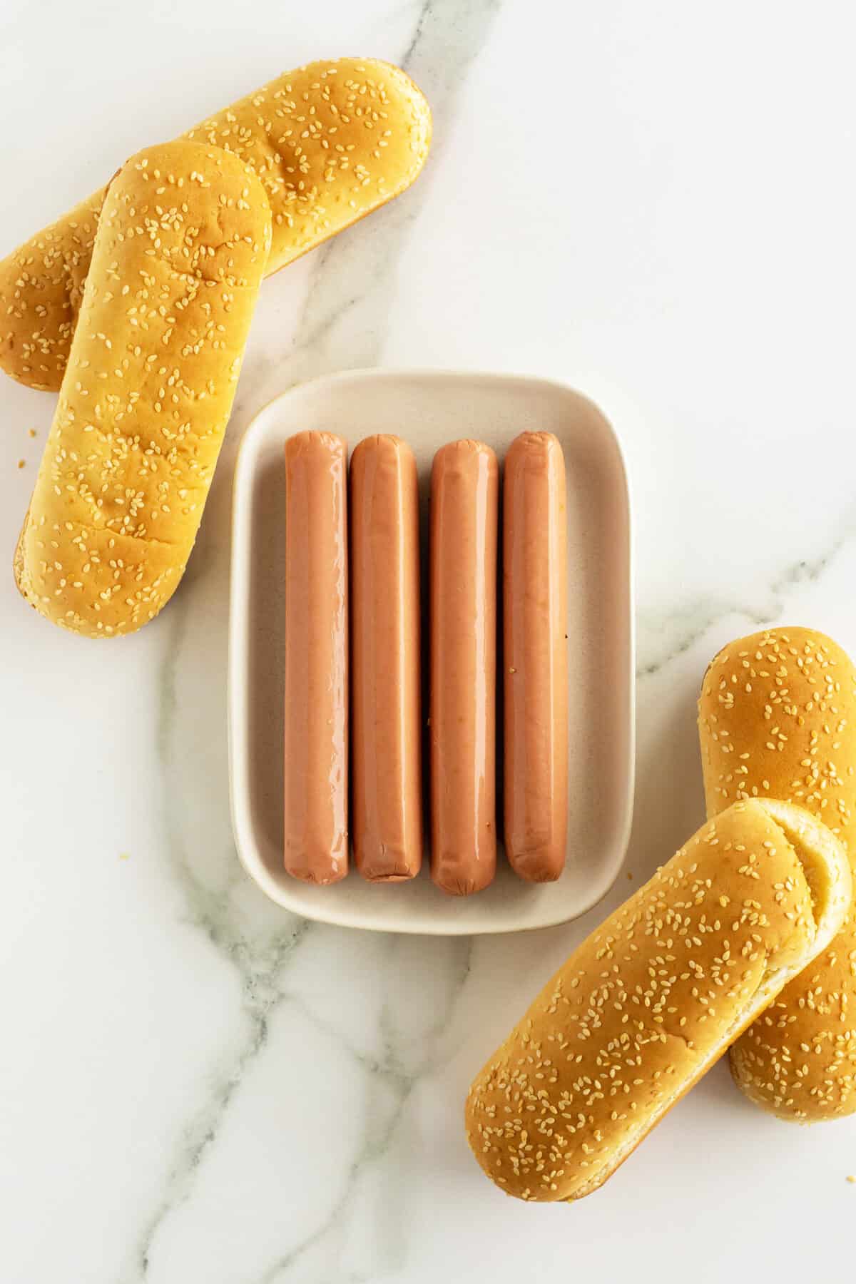 airfryer hot dogs ingredients on a white plate