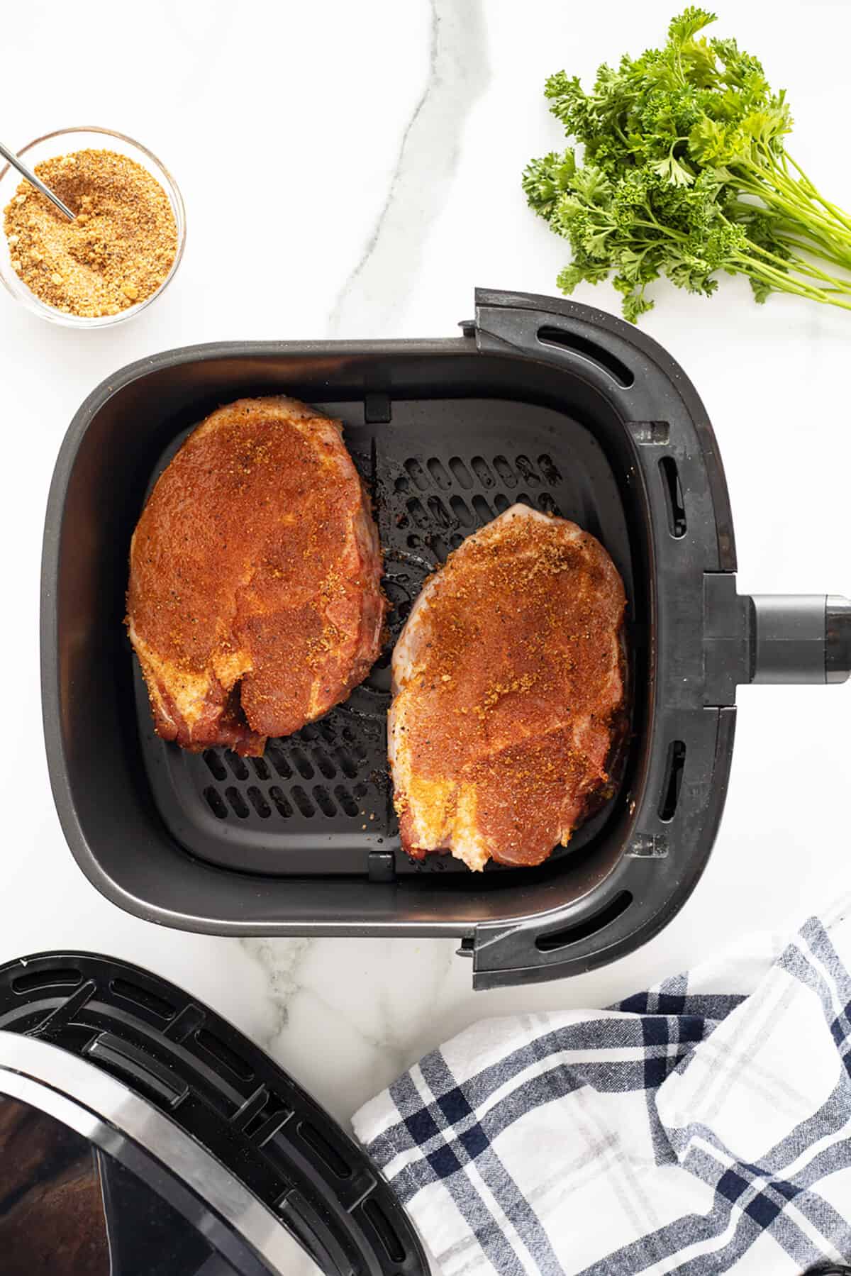 air fryer pork chops spiced in the air fryer basket